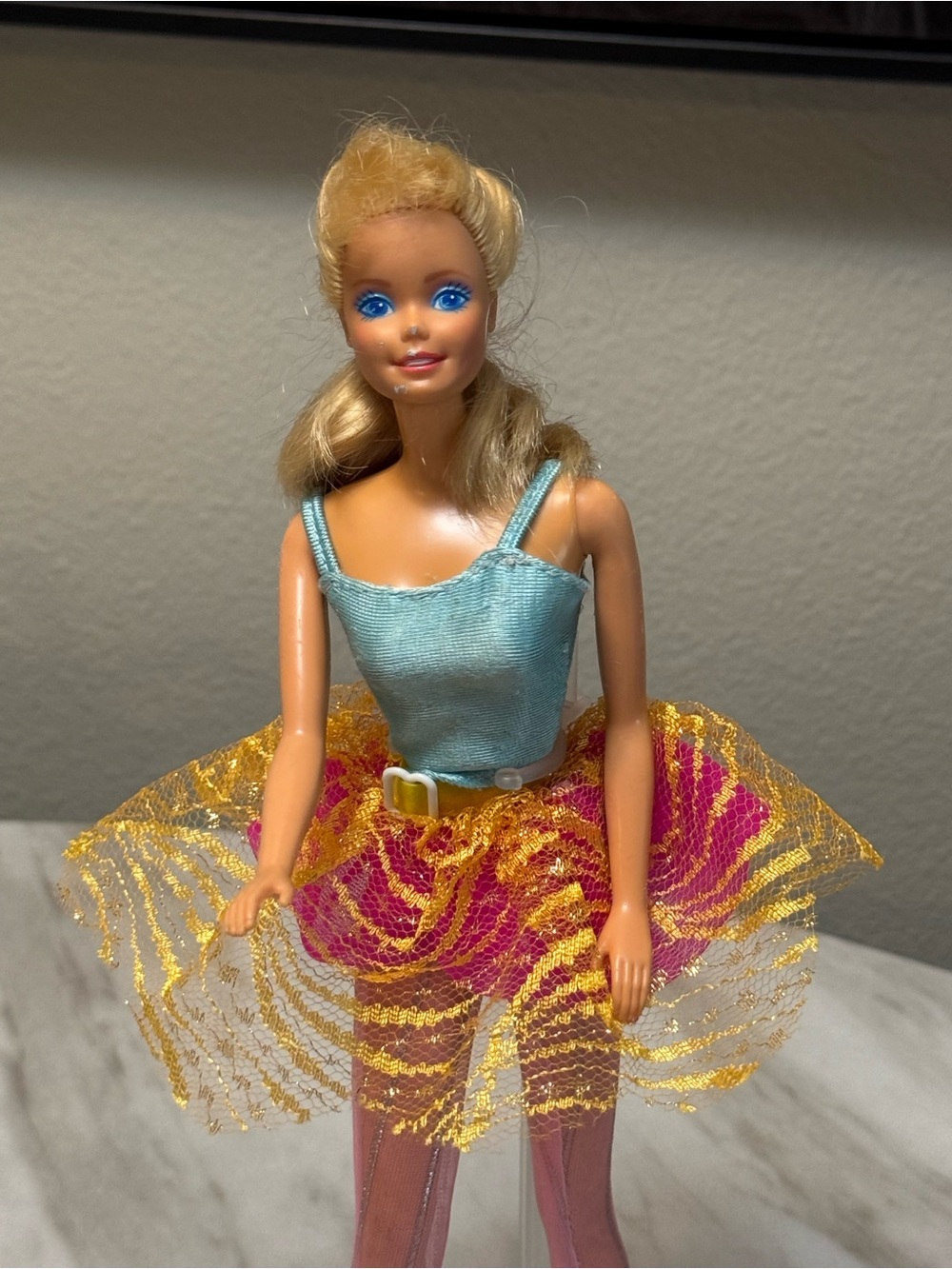 vintage blonde 1998 Bubble Fairy Barbie doll wearing a light blue top and a pink